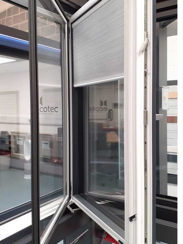Internorm tilt & turn window with integrated blinds and electric operated trickle vent Internorm tilt & turn window with integrated blinds and electric operated trickle vent